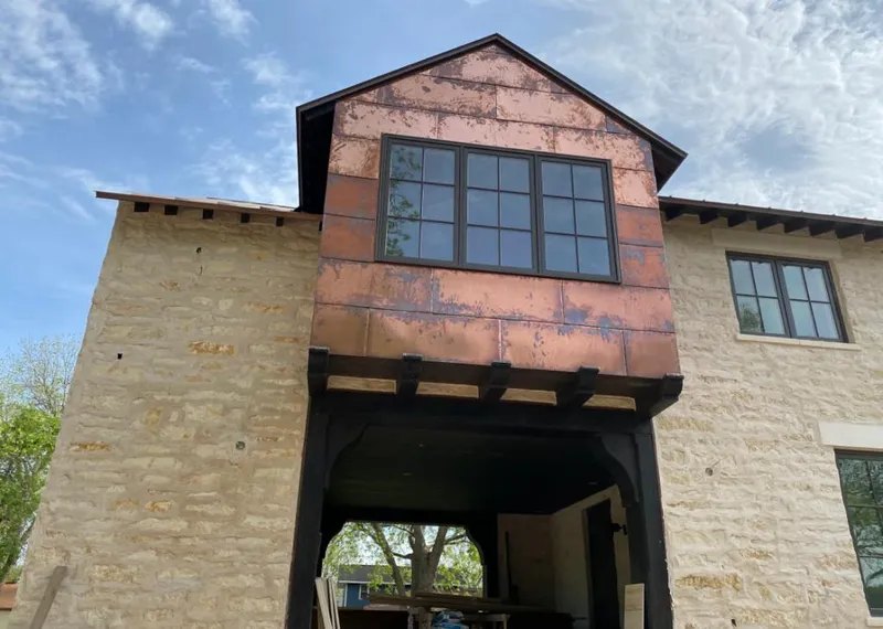 Copper metal panel facade on a stone building for Skylight Installation in Edgewater Park