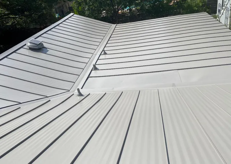 Solar attic fan installed on a metal roof for Roof Ventilation in Edgewater Park